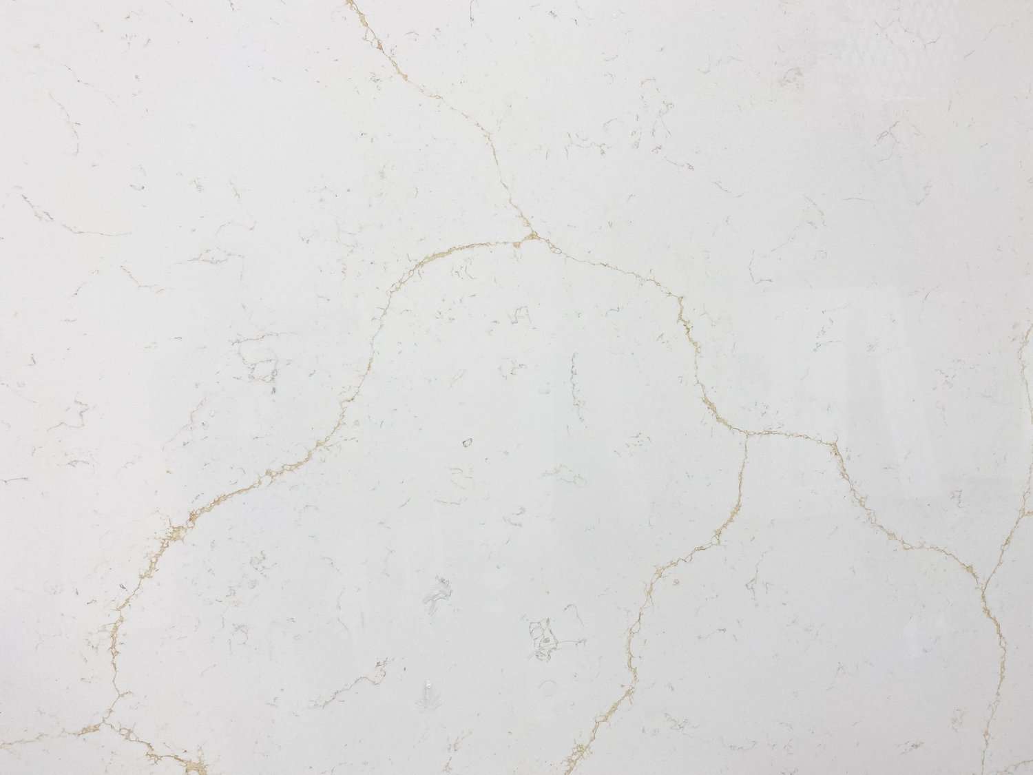 Quartz Countertop - Kitchen Countertop Upgrade your residential or commercial space with premium Meva granite, quartz, and marble kitchen countertop renovation services, perfect for your vanity, fireplace, and bath remodeling needs. Our Tom stone C 8201 Calacatte Quartz Countertop is a non-porous surface that is easy to clean and maintain. It is also heat-resistant and scratch-resistant, making it perfect for your kitchen. For cleaning, we recommend using mild detergent and lukewarm water. Avoid harsh cleaners, as they can damage the surface. Our quartz countertop is available in 1 size - 63” x 126” and comes in two thicknesses - 20mm and 30mm. It is available in a Polished finish.