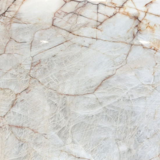 Cristalo Quartzite kitchen countertop with translucent white base and warm copper veining. Supplied and installed by MeVa Granite across Vancouver, Downtown Vancouver, Burnaby, Surrey, Coquitlam, Richmond, Langley, Maple Ridge, White Rock, North Vancouver, West Vancouver, Delta, Port Coquitlam, New Westminster, Pitt Meadows and all Metro Vancouver.