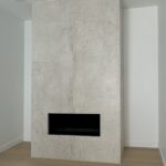 Modern stone fireplace installation in New Westminster and Metro Vancouver including Vancouver, Burnaby, Coquitlam, Surrey, Delta, Maple Ridge, Port Coquitlam, North Vancouver, West Vancouver and Downtown Vancouver. Dekton Lunar fireplace with seamless mitered edges.