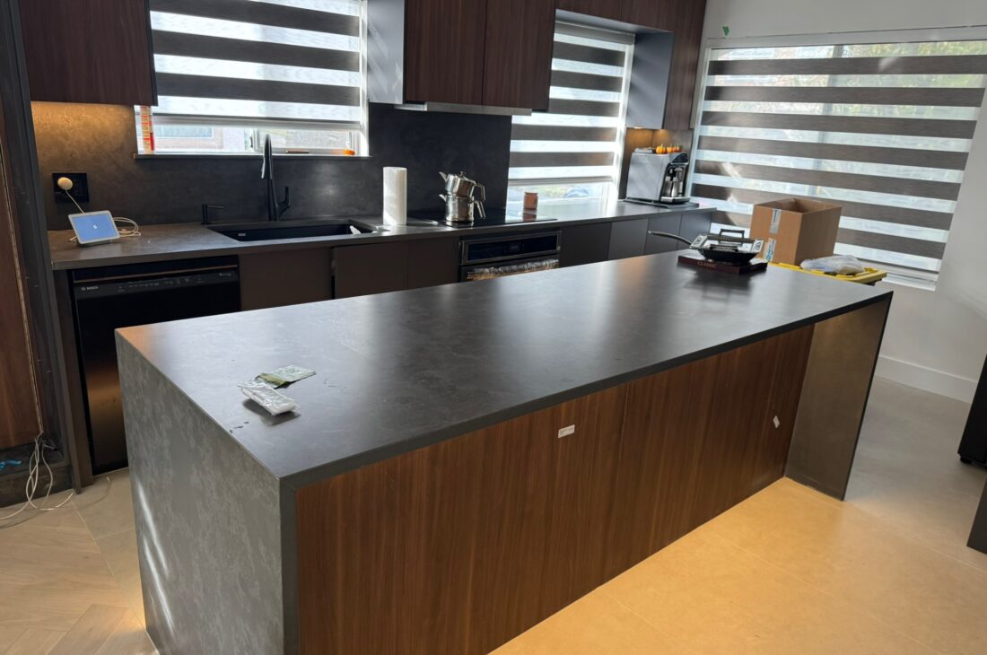 Kitchen quartz countertop and backsplash installation in North Vancouver and Metro Vancouver including Vancouver, Burnaby, Coquitlam, Surrey, Delta, Maple Ridge, Port Coquitlam, West Vancouver and Downtown Vancouver. Vicostone Tartufo with 2-sided waterfall island design.