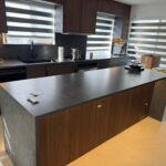 Kitchen quartz countertop and backsplash installation in North Vancouver and Metro Vancouver including Vancouver, Burnaby, Coquitlam, Surrey, Delta, Maple Ridge, Port Coquitlam, West Vancouver and Downtown Vancouver. Vicostone Tartufo with 2-sided waterfall island design.