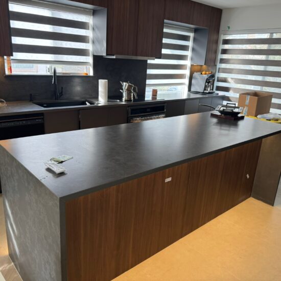 Kitchen quartz countertop and backsplash installation in North Vancouver and Metro Vancouver including Vancouver, Burnaby, Coquitlam, Surrey, Delta, Maple Ridge, Port Coquitlam, West Vancouver and Downtown Vancouver. Vicostone Tartufo with 2-sided waterfall island design.