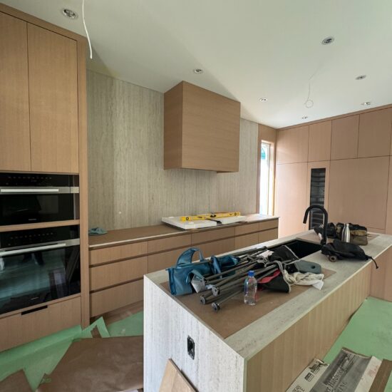 Kitchen quartz countertop and backsplash installation in New Westminster and Metro Vancouver including Vancouver, Burnaby, Coquitlam, Surrey, Delta, Maple Ridge, Port Coquitlam, North Vancouver, West Vancouver and Downtown Vancouver. Dekton Marmorio sintered stone with seamless modern design.