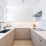 Luxury Vagli Vena 513 quartz kitchen countertops, waterfall island, vanity countertops, and full backsplash installation in Metro Vancouver including Vancouver, Burnaby, Surrey, Coquitlam, Delta, Maple Ridge, North Vancouver, West Vancouver, Port Coquitlam and Downtown Vancouver.