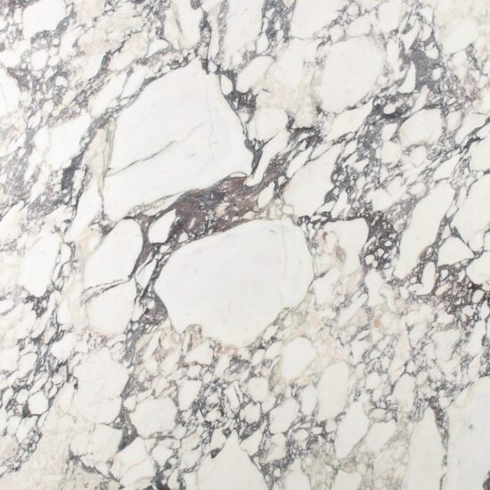 Premium Calacatta Viola Italian marble featuring dramatic burgundy and violet veining. Supplied, fabricated, and installed across Metro Vancouver. Call 778-848-9688.