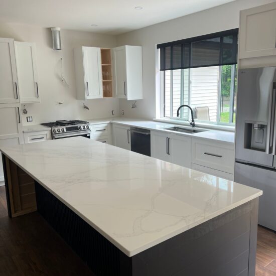 Custom quartz countertops in Maple Ridge featuring Hari Stone Irah 514 Borghini in 3cm thickness. Full kitchen countertops, island, window sill, and custom quartz sink cover professionally fabricated and installed by MeVa Granite.