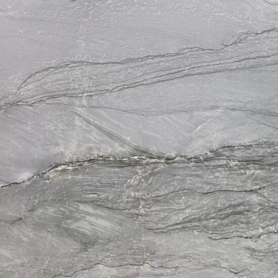 Thunderbolt Quartzite features dramatic grey and blue movement with a leathered finish. Professionally supplied, fabricated, and installed by MeVa Granite across Metro Vancouver.