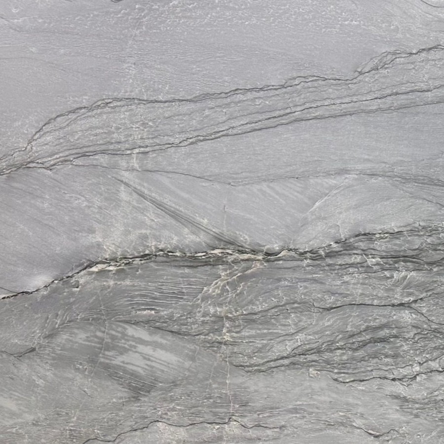 Thunderbolt Quartzite features dramatic grey and blue movement with a leathered finish. Professionally supplied, fabricated, and installed by MeVa Granite across Metro Vancouver.